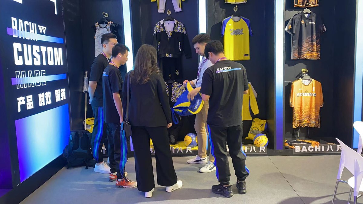 BACHI SPORTS team meeting buyers at a sports trade show